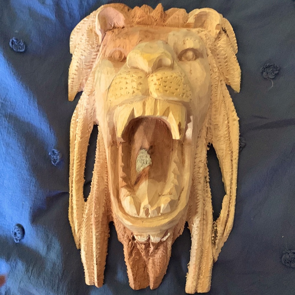 Hand carved one of a kind Lion Head wall art from Jamaica Natural finish.